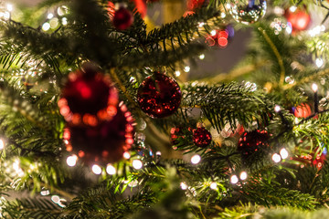Fototapeta na wymiar Christmas decorations in the Christmas tree. blurred background photo