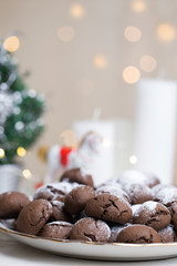 Chocolate brownie cookies in powdered sugar.