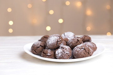 Chocolate Crinkle Cookies in powdered sugar.