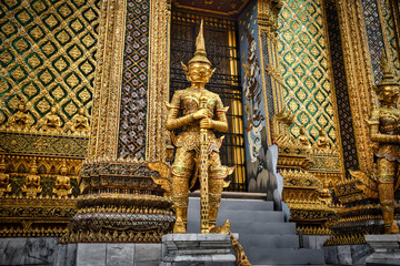 Beautifully stunning gold statue of a Kinnara, a beloved mythical half-human, half-bird creature on the Upper Terrace of Wat Phra Kaew or Temple of the Emerald Buddha in the Grand Palace in Bangkok