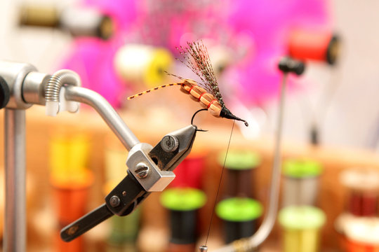 A closeup image of a freshly tied fly (fishing lure).