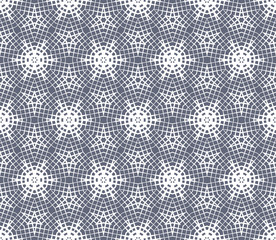 Abstract seamless pattern of geometric shapes. Stars in a hexagonal grid.