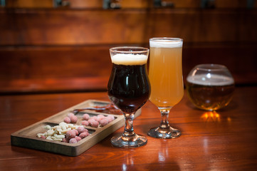 Different varieties of pees are on the bar in the pub.