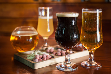 Different varieties of pees are on the bar in the pub.