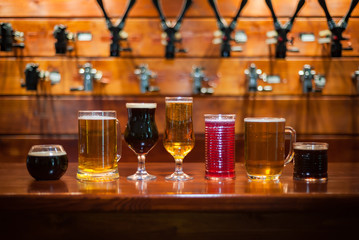 Different varieties of pees are on the bar in the pub.