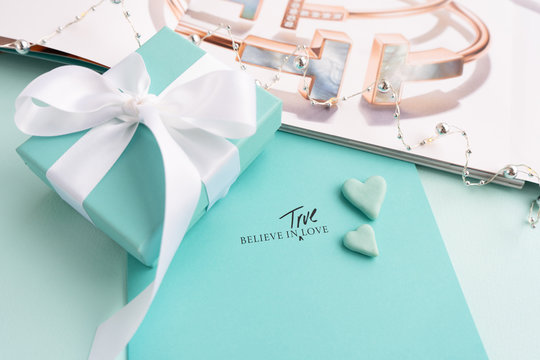 Minsk, Belarus. November, 2019: Luxury, trendy jewelry Tiffany box.  The world-famous American fashion brand. Silver and gold jewelry - best present for every holiday.