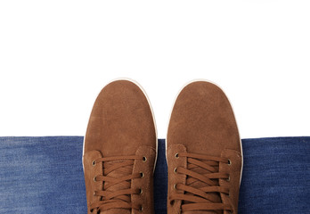 brown sneakers on the jeans background