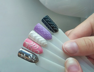 Pastel winter designs on the tips. Stylish drawings on manicure tips similar to a knitted sweater...