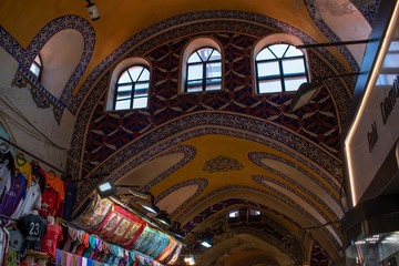 Istanbul: turkish flag and ceiling decorations inside the Grand Bazaar, one of the largest and...