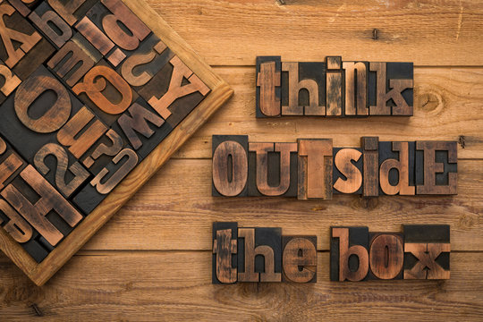 Think outside the box, phrase written with vintaqge letterpress type