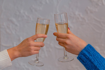  glasses of champagne in female hands alcohol party concept wallpaper pattern picture on white textured background copy space for your text here 