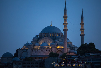 Istanbul, Turkey, Middle East: night skyline of the city with view of the illuminated Suleymaniye mosque, Ottoman imperial mosque commissioned by Suleiman the Magnificent and designed by Mimar Sinan