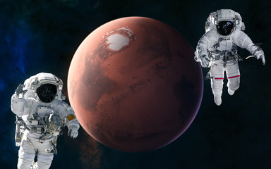Astronauts, red planet. Mars, the solar system. Science fiction. Elements of this image furnished by NASA