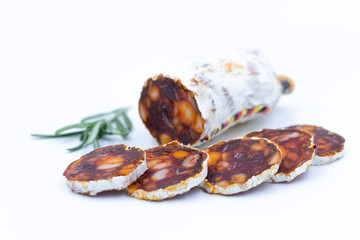 Chorizo. Traditional Spanish salami with paprika. White background. The isolated image.