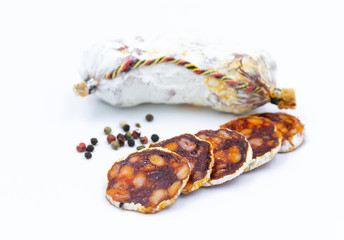Chorizo. Traditional Spanish salami with paprika. White background. The isolated image.