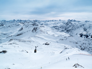 Fototapeta na wymiar Panoramic view of the ski resort in Alps.