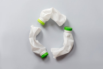 Used white plastic packaging for food on a gray background