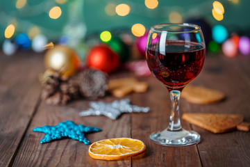 Glasses of champagne and christmas gifts on wooden background