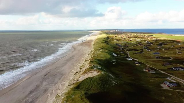 Aerial footage of a danish beach and dunes near Hvide Sande