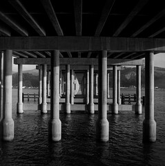 Pillars beneath a highway bridge 