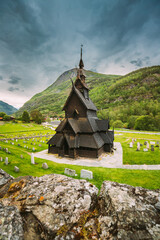Borgund, Norway. Famous Landmark Stavkirke An Old Wooden Triple Nave Stave Church In Summer Day. Ancient Old Wooden Worship In Norwegian Countryside Landscape