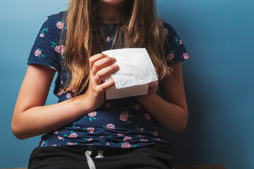 Girl pulling toilet paper tissue
