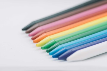 Rainbow colorful crayons isolated on a white background
