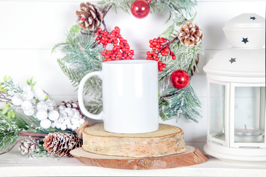 mug mockup for design show - mug  with fir branches, cones and lantern