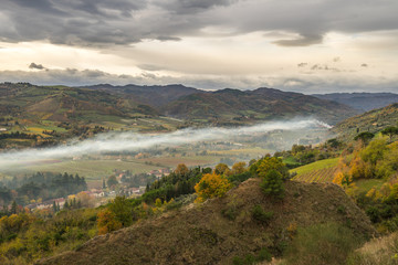 The valley of river Lamone with smoke