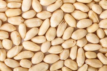 peeled raw peanuts  on a white background
