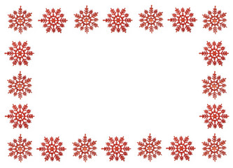Frame of red snowflakes on a white isolated background. Christmas Time. Holiday card, copy space.