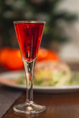 Set of glasses with different colored tinctures made on the basis of fruits and alcohol, a wonderful aperitif before the festive dinner