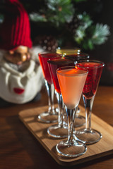 Set of glasses with different colored tinctures made on the basis of fruits and alcohol, a wonderful aperitif before the festive dinner