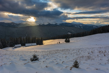 Colorful winter dawn on the mountain valleys in the Ukrainian Carpathian Mountains.	