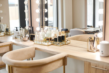 Dressing room interior with makeup mirror and table. Place for applying makeup