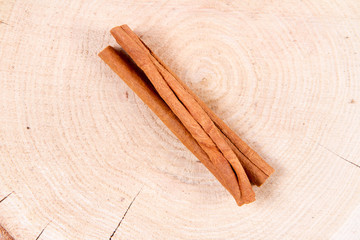 Cinnamon sticks on a wooden background