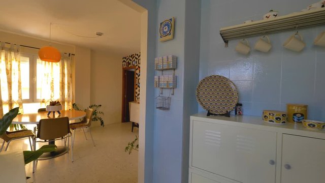  Real estate virtual tour. Camera fly-through the interior of a retro decorated home. Vintage living room and kitchen.