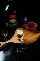 little beverage shot on wooden board