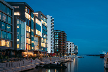 Oslo, Norway. Night View Embankment And Residential Multi-storey Houses In Aker Brygge District....