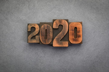 Fototapeta na wymiar Year 2020 set with vintage letterpress printing blocks on grey textured background