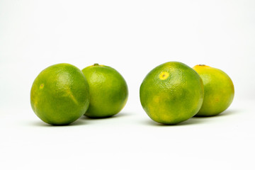 four tangerines on the table
