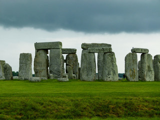 stonehenge in england with dark clouds