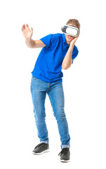 Young man with VR glasses on white background