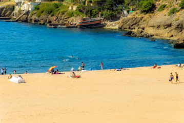 Fototapeta premium Istanbul, Turkey, 31 May 2006: Riva Beach, .Peoples sunbathing, Black Sea, Riva, Beykoz.
