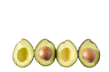 A cut row of avocados isolated on white with copy space