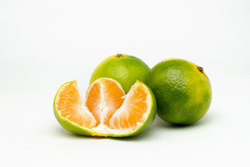 Fototapeta na wymiar opened green tangerine on the table