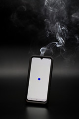 smoke coming from a smartphone with a white screen