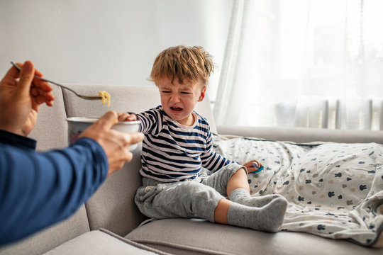 Toddler Boy Does Not Want To Eat. I Don't Wanna! Little Baby Boy Crying And Screaming During Eating. Toddler Boy Cry, Capricious, Refuse To Eat Is Not Hungry. I Don't Wanna!