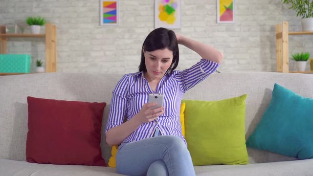 young woman is experiencing scalp problems itching and dandruff