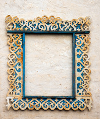 Carved antique platbands on the white wall.